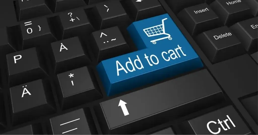 Como Criar um Site de vendas em 2026. Teclado bem aproximado da tecla Enter com os dizeres: "Add to cart."